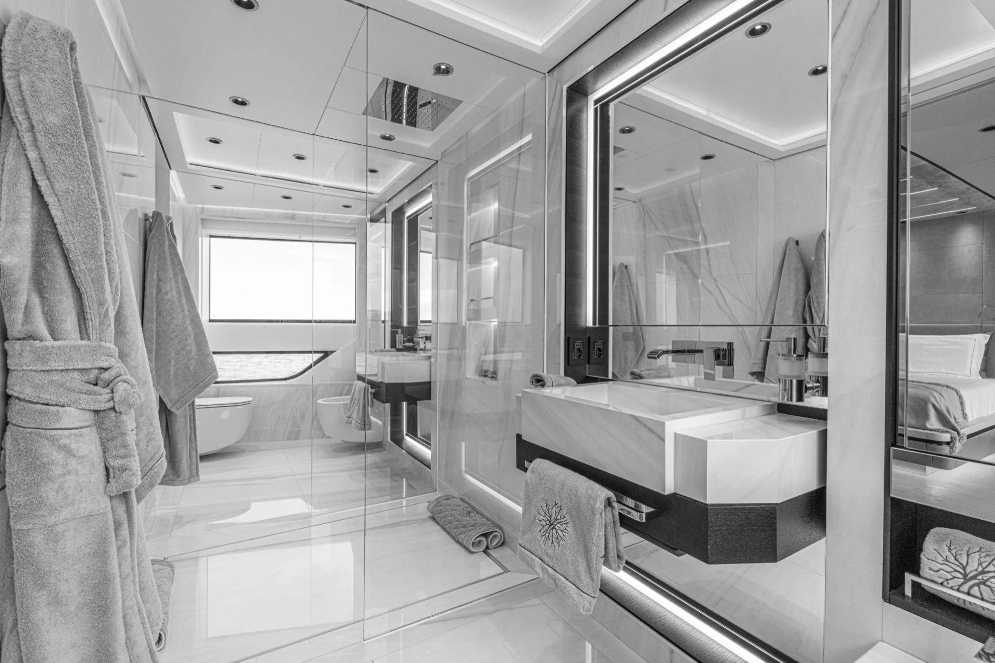 Beltrami bathrobes and towels arranged in a yacht bathroom